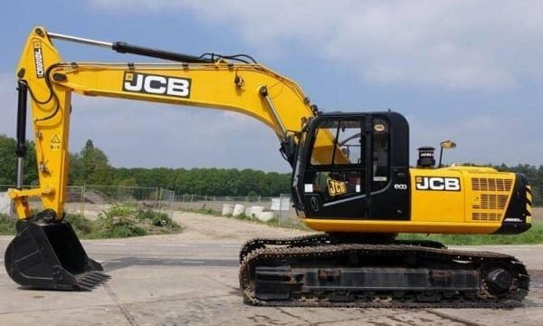 JCB tracked excavator parked at a construction site, featuring a hydraulic arm and digging bucket ready for earthmoving work